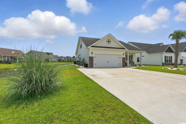 668 Rycola Cir, Surfside Beach, SC 29575 - view of front of home featuring brick siding, a front yard, driveway, and an attached garage