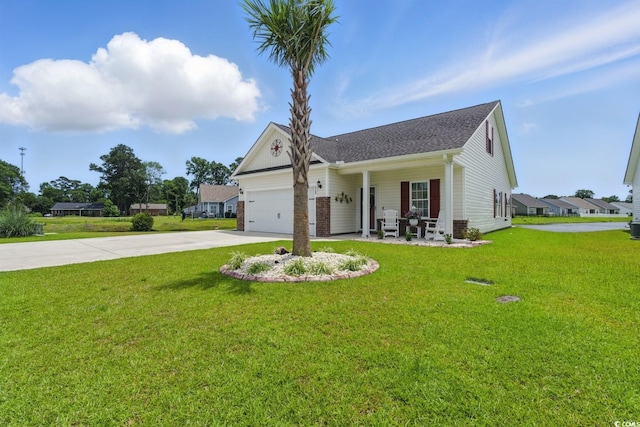 668 Rycola Cir, Surfside Beach, SC 29575 - view of front of home with concrete driveway, a front yard, covered porch, a garage, and a shingled roof