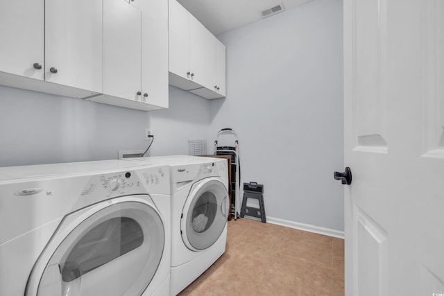 4520 Lighthouse Dr Unit 29B, Little River, SC 29566 - laundry area featuring cabinet space, washer and clothes dryer, and light tile patterned flooring