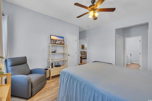4520 Lighthouse Dr Unit 29B, Little River, SC 29566 - bedroom with light wood finished floors, connected bathroom, and a ceiling fan