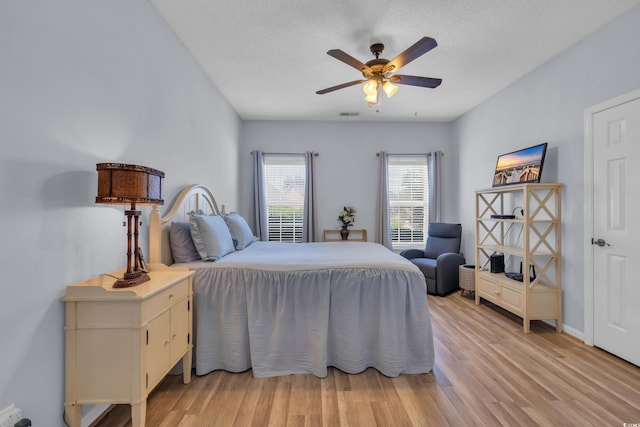 4520 Lighthouse Dr Unit 29B, Little River, SC 29566 - bedroom with light wood-style floors and ceiling fan