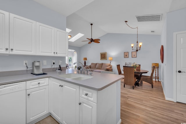 4520 Lighthouse Dr Unit 29B, Little River, SC 29566 - kitchen featuring dishwasher, a peninsula, vaulted ceiling, a ceiling fan, and a chandelier