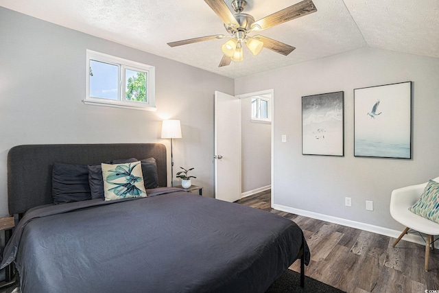 1930 Lake View Cir, Myrtle Beach, SC 29575 - bedroom featuring dark wood-type flooring, a textured ceiling, ceiling fan, and vaulted ceiling