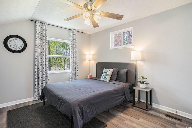 1930 Lake View Cir, Myrtle Beach, SC 29575 - bedroom featuring a textured ceiling, wood finished floors, and ceiling fan
