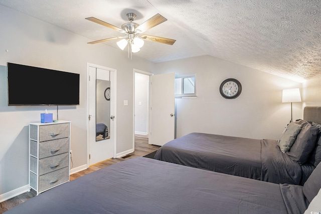 1930 Lake View Cir, Myrtle Beach, SC 29575 - bedroom with wood finished floors, lofted ceiling, a textured ceiling, and a ceiling fan