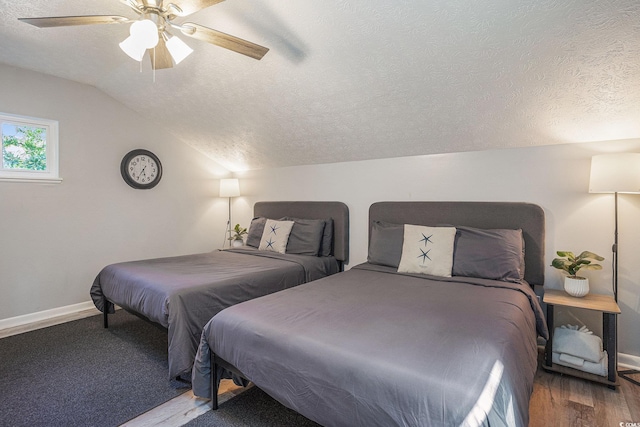 1930 Lake View Cir, Myrtle Beach, SC 29575 - bedroom featuring a textured ceiling, wood finished floors, vaulted ceiling, and a ceiling fan