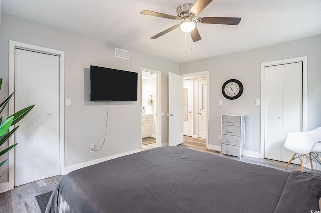 1930 Lake View Cir, Myrtle Beach, SC 29575 - bedroom with wood finished floors, a ceiling fan, and ensuite bath
