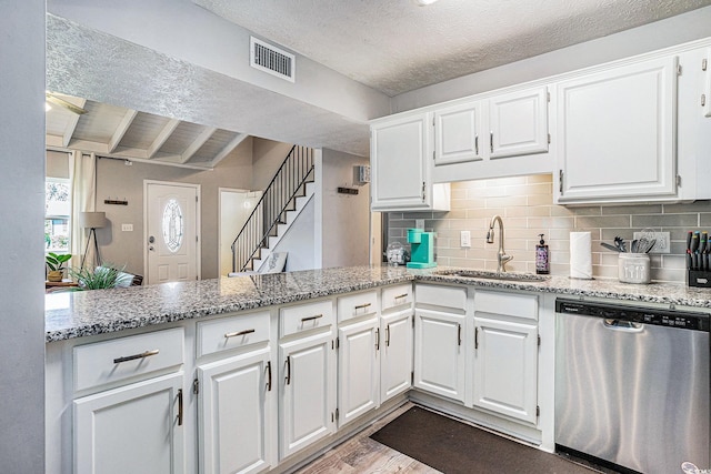 1930 Lake View Cir, Myrtle Beach, SC 29575 - kitchen with dishwasher, white cabinetry, dark wood-style flooring, backsplash, and a textured ceiling