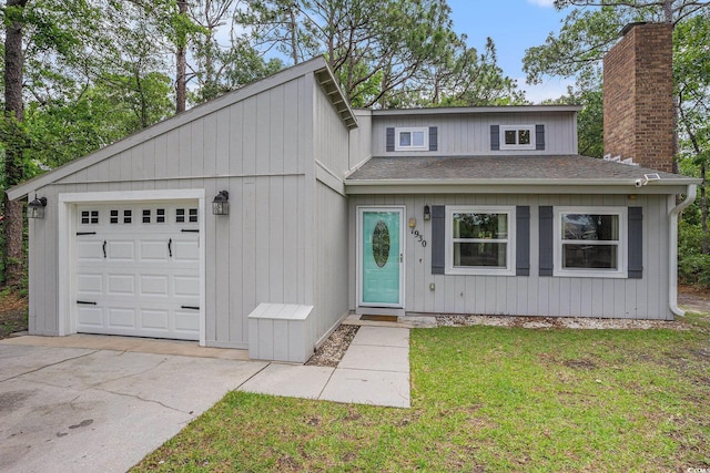1930 Lake View Cir, Myrtle Beach, SC 29575 - view of front of house with roof with shingles, a chimney, an attached garage, a front lawn, and driveway