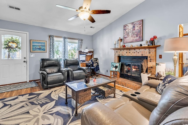 201 Surrey Ln, Myrtle Beach, SC 29579 - living area featuring lofted ceiling, wood finished floors, ceiling fan, and a brick fireplace