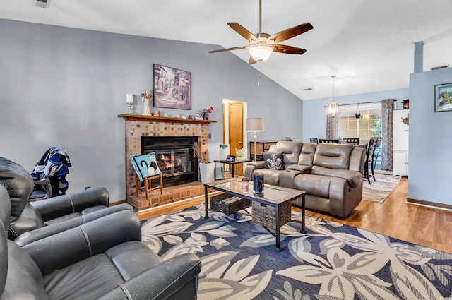 201 Surrey Ln, Myrtle Beach, SC 29579 - living area with ceiling fan, wood finished floors, lofted ceiling, and a fireplace