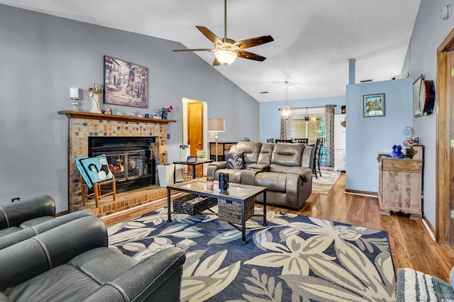 201 Surrey Ln, Myrtle Beach, SC 29579 - living room featuring a ceiling fan, lofted ceiling, wood finished floors, and a fireplace