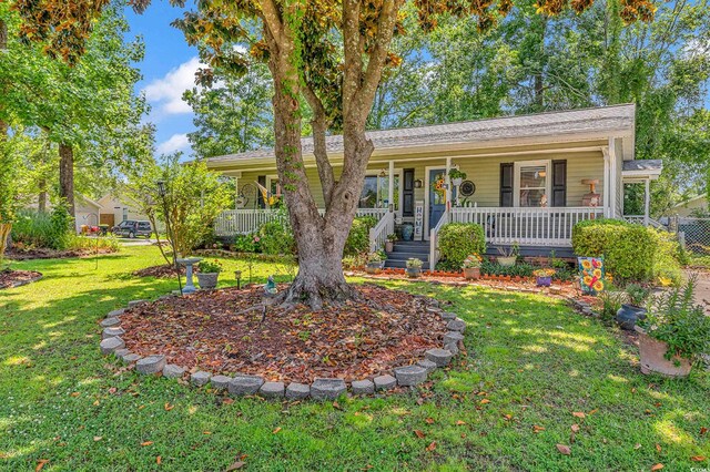 201 Surrey Ln, Myrtle Beach, SC 29579 - ranch-style house with covered porch and a front lawn