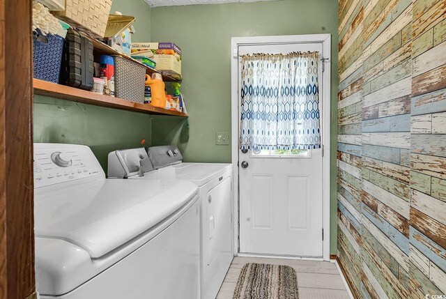 201 Surrey Ln, Myrtle Beach, SC 29579 - washroom with wood walls and washing machine and dryer
