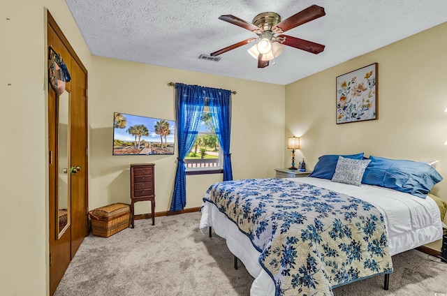 201 Surrey Ln, Myrtle Beach, SC 29579 - carpeted bedroom with a textured ceiling and a ceiling fan