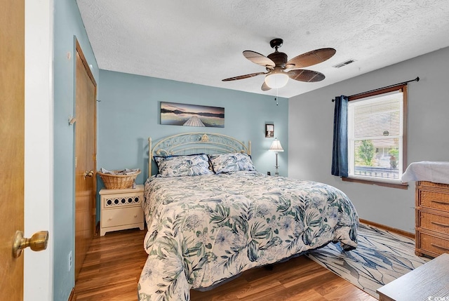 201 Surrey Ln, Myrtle Beach, SC 29579 - bedroom with wood finished floors, a textured ceiling, and ceiling fan
