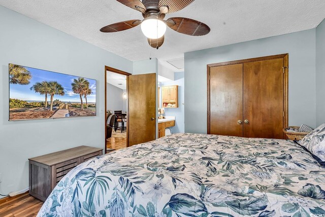 201 Surrey Ln, Myrtle Beach, SC 29579 - bedroom featuring a closet, wood finished floors, ceiling fan, and a textured ceiling