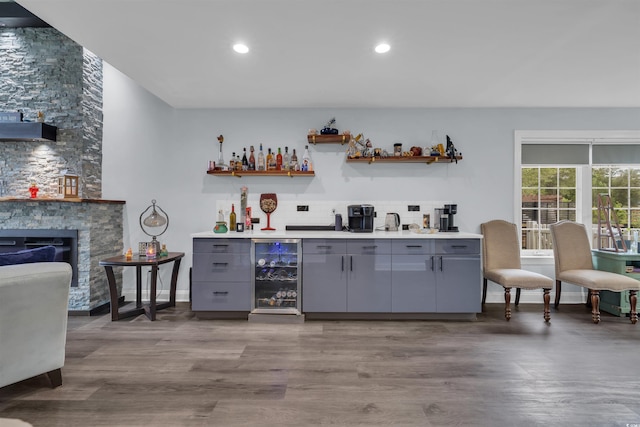 35 Easter Lilly Ct, Murrells Inlet, SC 29576 - indoor wet bar with wine cooler, wood finished floors, backsplash, a fireplace, and recessed lighting