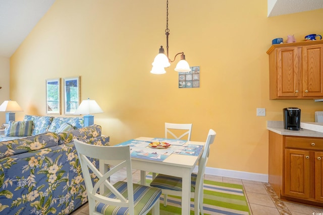 6172 Catalina Dr Unit 414H, North Myrtle Beach, SC 29582 - dining area featuring a chandelier, light tile patterned floors, and high vaulted ceiling