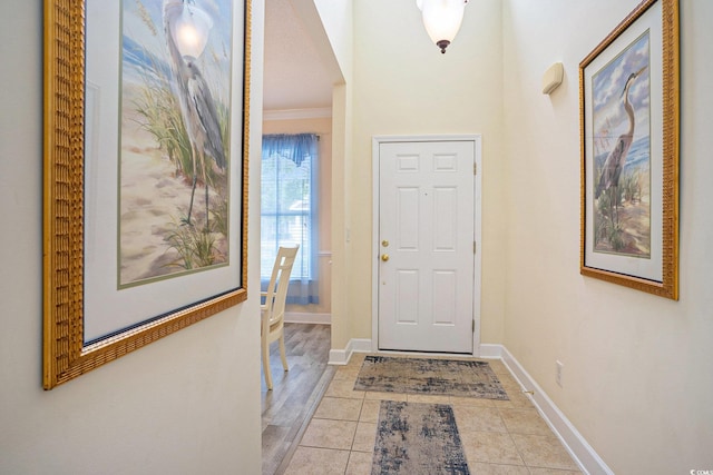 6172 Catalina Dr Unit 414H, North Myrtle Beach, SC 29582 - tiled entryway with baseboards and crown molding