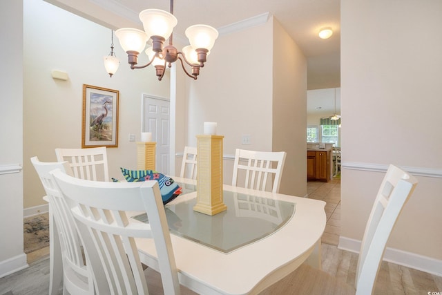 6172 Catalina Dr Unit 414H, North Myrtle Beach, SC 29582 - dining room with a chandelier, ornamental molding, and light wood-style floors