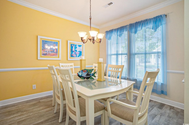 6172 Catalina Dr Unit 414H, North Myrtle Beach, SC 29582 - dining room featuring a chandelier, ornamental molding, and wood finished floors