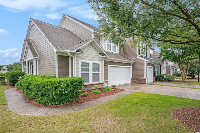 6172 Catalina Dr Unit 414H, North Myrtle Beach, SC 29582 - view of front of house featuring driveway, a shingled roof, a garage, and a front yard