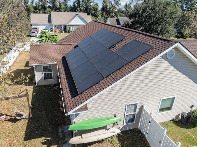 200 Silverbelle Blvd, Longs, SC 29568 - back of house featuring a shingled roof and solar panels