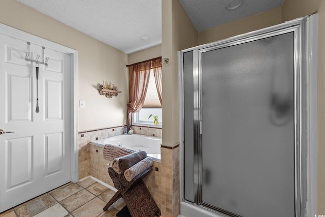 200 Silverbelle Blvd, Longs, SC 29568 - bathroom with a shower stall, a bath, and a textured ceiling