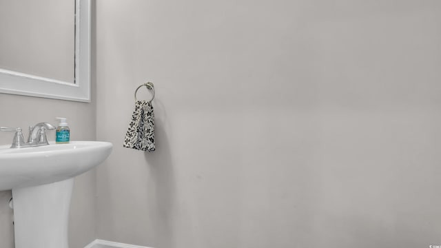 356 Ocean Commons Dr, Surfside Beach, SC 29575 - bathroom featuring a sink and baseboards