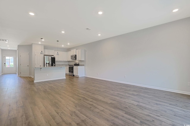 184 Sea Shell Dr Unit 12, Murrells Inlet, SC 29576 - unfurnished living room with wood finished floors and recessed lighting