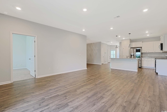 184 Sea Shell Dr Unit 12, Murrells Inlet, SC 29576 - unfurnished living room featuring light wood finished floors and recessed lighting