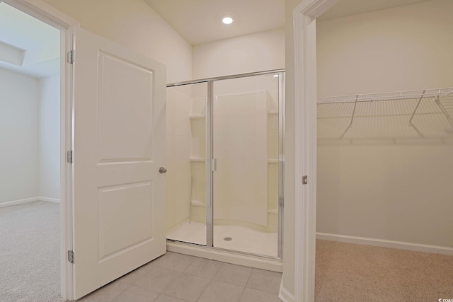 184 Sea Shell Dr Unit 12, Murrells Inlet, SC 29576 - full bathroom featuring a stall shower, a walk in closet, tile patterned flooring, and recessed lighting