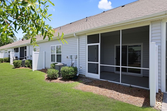 184 Sea Shell Dr Unit 12, Murrells Inlet, SC 29576 - rear view of property with a yard, roof with shingles, and a sunroom