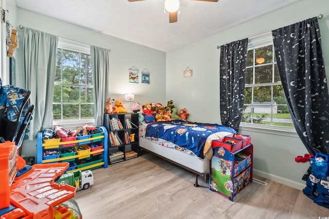 169 Ole Maple St, Loris, SC 29569 - bedroom with wood finished floors and a ceiling fan
