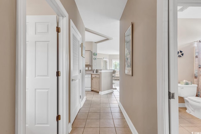 876 Palmetto Trl Unit 103, Myrtle Beach, SC 29577 - hallway featuring light tile patterned flooring and baseboards