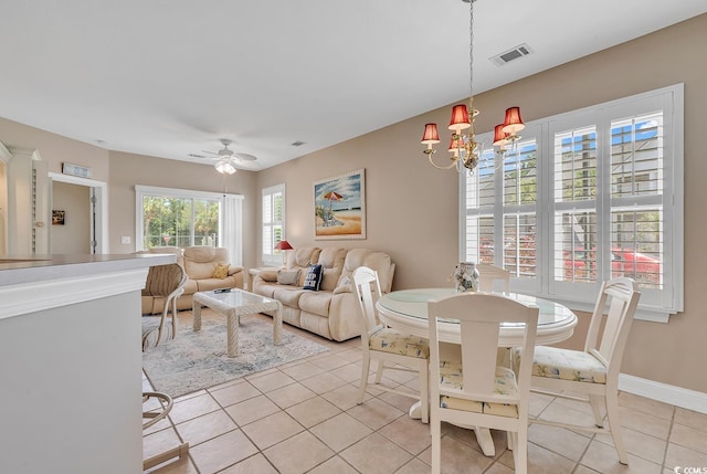 876 Palmetto Trl Unit 103, Myrtle Beach, SC 29577 - dining space featuring a chandelier, light tile patterned flooring, and a ceiling fan