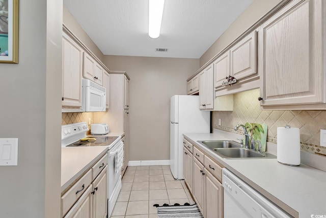 876 Palmetto Trl Unit 103, Myrtle Beach, SC 29577 - kitchen with white appliances, light countertops, decorative backsplash, and light tile patterned floors