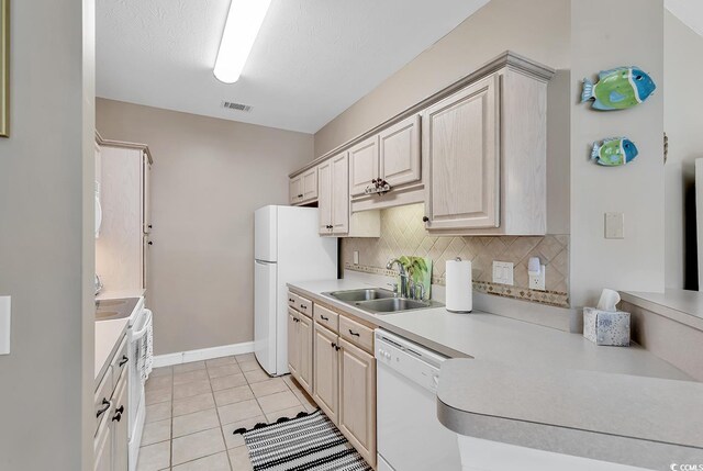 876 Palmetto Trl Unit 103, Myrtle Beach, SC 29577 - kitchen featuring white appliances, light countertops, backsplash, and light tile patterned flooring