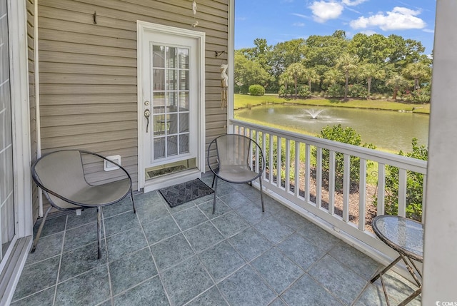 876 Palmetto Trl Unit 103, Myrtle Beach, SC 29577 - balcony featuring a water view and view of wooded area