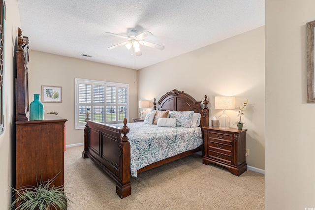 503 N 20th Ave N Unit 41D, North Myrtle Beach, SC 29582 - bedroom featuring light carpet, a textured ceiling, and ceiling fan