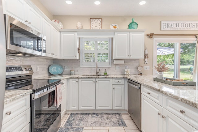 503 N 20th Ave N Unit 41D, North Myrtle Beach, SC 29582 - kitchen with stainless steel appliances, white cabinets, tasteful backsplash, and recessed lighting