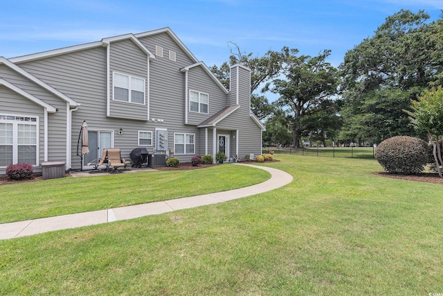 503 N 20th Ave N Unit 41D, North Myrtle Beach, SC 29582 - view of front facade with a chimney and a patio