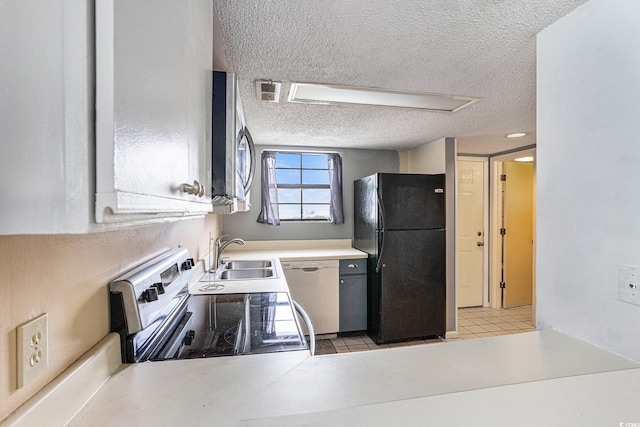 6703 Jefferson Pl Unit G5, Myrtle Beach, SC 29572 - kitchen featuring stainless steel appliances, a textured ceiling, light floors, and light countertops