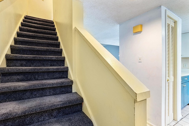 6703 Jefferson Pl Unit G5, Myrtle Beach, SC 29572 - staircase featuring a textured ceiling