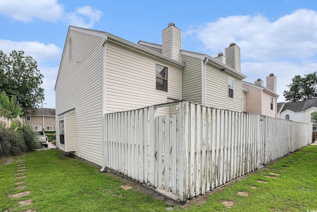 6703 Jefferson Pl Unit G5, Myrtle Beach, SC 29572 - view of property exterior featuring a chimney