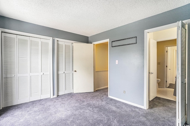 6703 Jefferson Pl Unit G5, Myrtle Beach, SC 29572 - unfurnished bedroom with multiple closets, carpet floors, and a textured ceiling