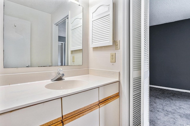 6703 Jefferson Pl Unit G5, Myrtle Beach, SC 29572 - bathroom with a textured ceiling and vanity