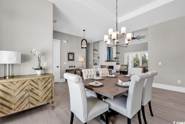 558 Oxbow Dr, Myrtle Beach, SC 29579 - dining area with a chandelier, wood finished floors, and built in shelves