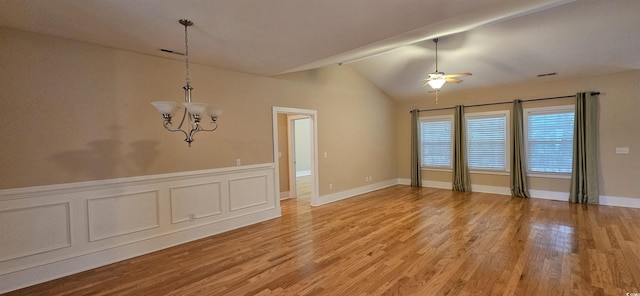 309 Outboard Dr, Murrells Inlet, SC 29576 - unfurnished dining area featuring a chandelier, lofted ceiling, light wood finished floors, a ceiling fan, and a wainscoted wall